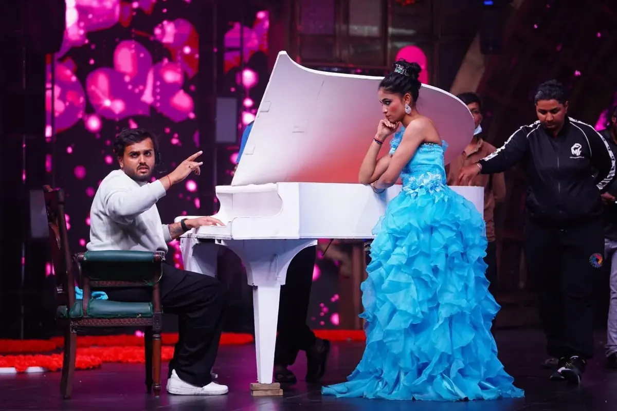 Grand Piano Performance Directing. Utkarsh directing an emotional musical act at the grand white piano on reality set., Utkarsh Jayesh Suratwala