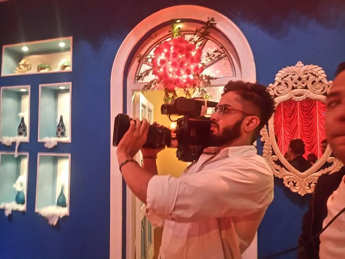 Behind a broadcast camera, Utkarsh Jayesh Suratwala