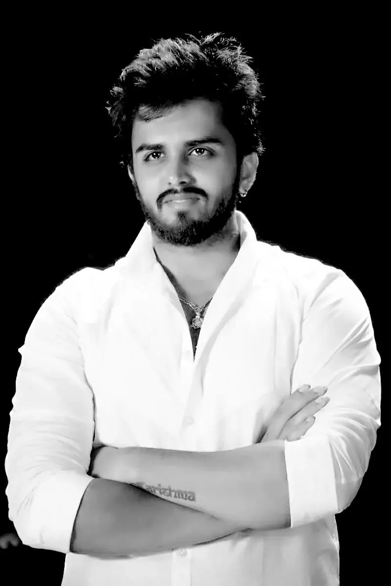 Black and white studio portrait of director Utkarsh Jayesh Suratwala